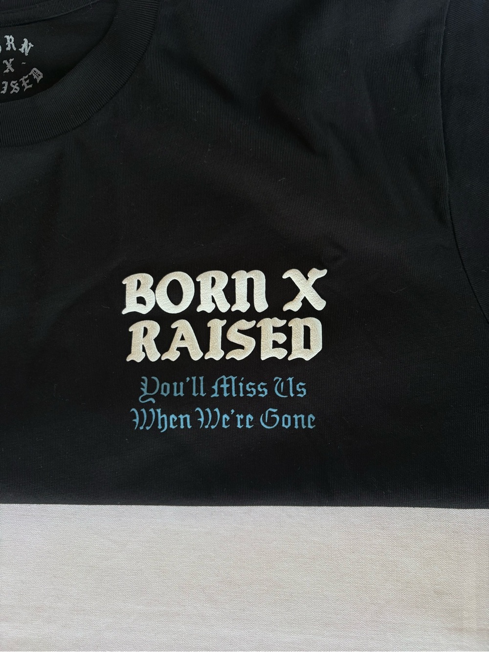 BORN X RAISED Black Tee with White Raised Logo
